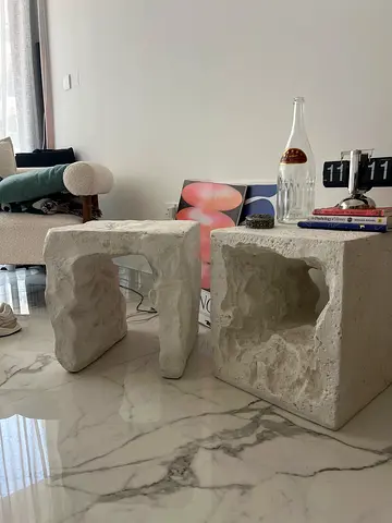 Pair of carved stone side tables / sculptural stools