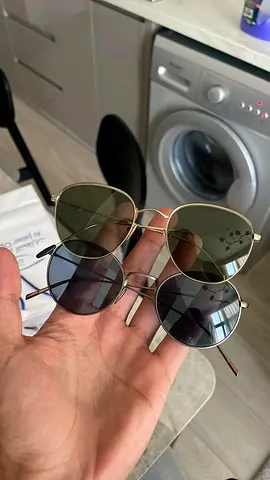 Collection of Two Pairs of Round Metal Frame Sunglasses