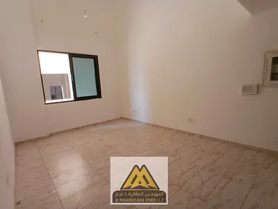 For rent: 1-bedroom apartment in Al Alia, Ajman, ground floor, master bedroom, 2 bathrooms, closed kitchen, central AC, free maintenance.