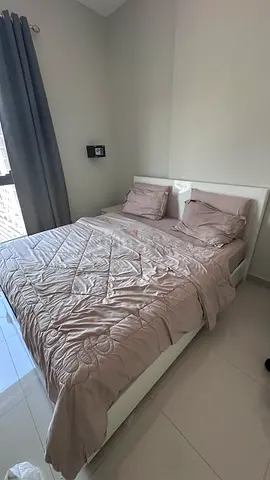 White double bed frame with headboard and storage