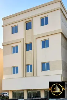 A building at the entrance to Al-Aliya, opposite the Al-Raqayeb area, in front of the Al-Raqayeb cri