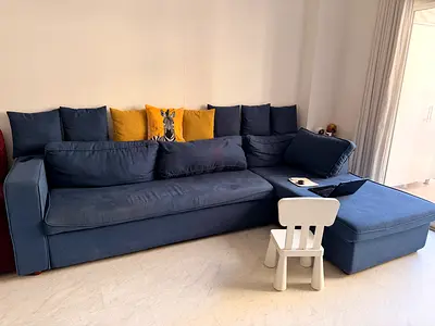 Large Blue L-Shaped Sofa with Ottoman — Good Condition