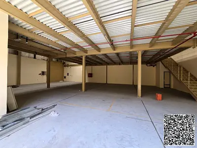 Warehouse for rent in Al Jurf 1 Ajman 6000 sq ft with mezzanine and 30 KW electricity. First floor 3520 sq ft mezzanine 2480 sq ft. AED 300K yearly in
