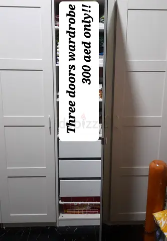 Three-door white wardrobe with drawers - good condition