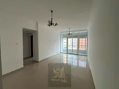 One-bedroom apartment with a living room, featuring a distinctive view and access to a gym and swimm