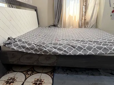 Queen size bed frame with upholstered headboard - dark wood
