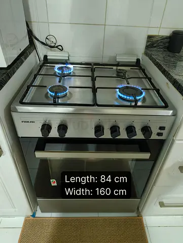 Stainless Steel 4-Burner Gas Stove with Oven - Good Condition