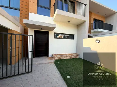 Luxurious 4-bedroom townhouse with a living room, private garden, and maid's room for annual rent in Azha community. Excellent location, close to all
