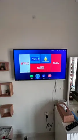 42-55 Wall-Mounted Smart LED TV with Built-in Apps (Netflix, YouTube) - Good Condition
