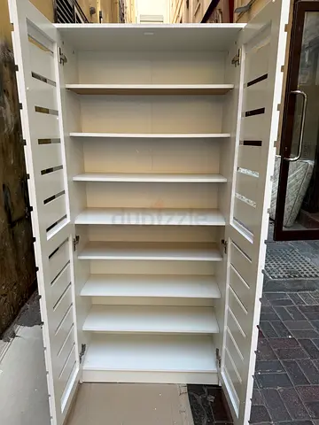 White Wooden Shoe Cabinet with Multiple Shelves and Slatted Doors