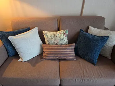 Six Cushions - Good Condition as inly a few months old. One is a Donna Karen