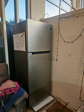 Used stainless steel double-door refrigerator - good working condition