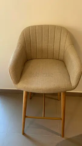 Beige Upholstered Bar Stool with Wooden Legs - Good Condition