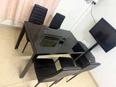 Glass Top Dining Table with 4 Black Faux Leather Chairs