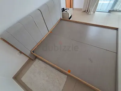 King size (180x200) bed frame with upholstered headboard - light wood.