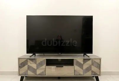 43 inch Flat Panel Aftron brand TV in Good Condition with Stand(table)