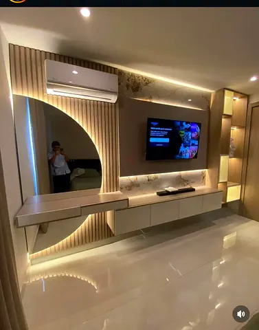 Modern wall-mounted entertainment unit with integrated shelves and vanity