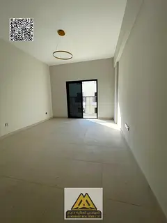 Spacious studio apartment for rent in Kintia Residence – Al Zahiyah, Ajman | Balcony | Central air
