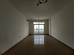 Spacious 2bhk in al mujhra near to new day center central ac central gas family building with parkin