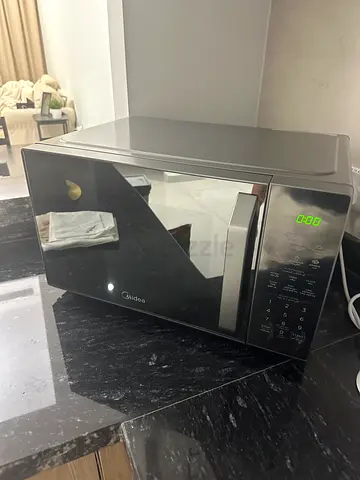Midea Microwave - Excellent Condition - 150 aed
