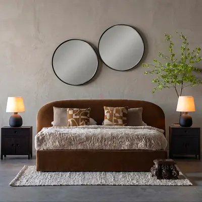 Brown upholstered bed with headboard and matching nightstands