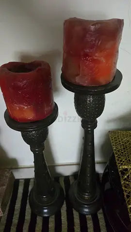 Pair of vintage-style metal candle holders with red pillar candles