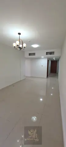 We present to you today a distinctive apartment in New Muwaileh, opposite Al Zahia—a prime, vibrant location. This is a "second-occupancy" unit featur