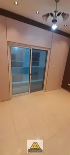 Two bedrooms and a living room with a balcony in City Towers, Al Nuaimiya 3 area, opposite Grand Mal