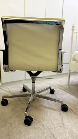 White leather swivel office chair with chrome base