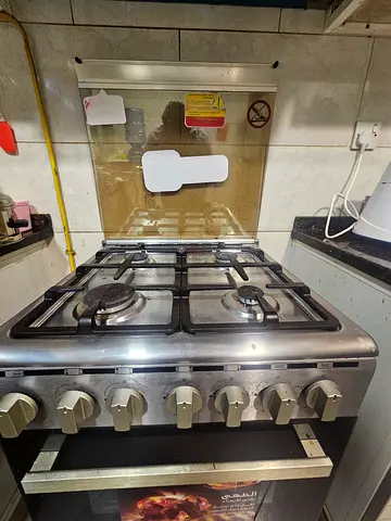 Freestanding stainless steel gas range with oven - used, working