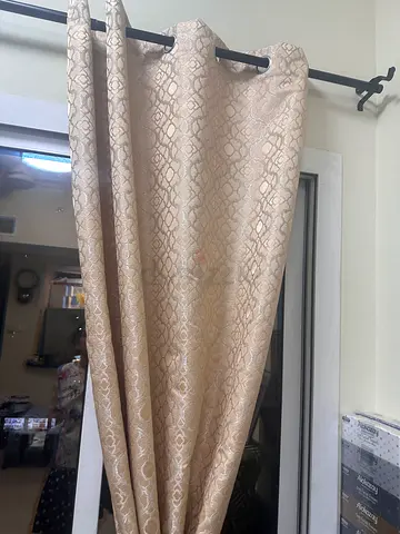 Pair of beige patterned blackout curtains with rod-4 pcs