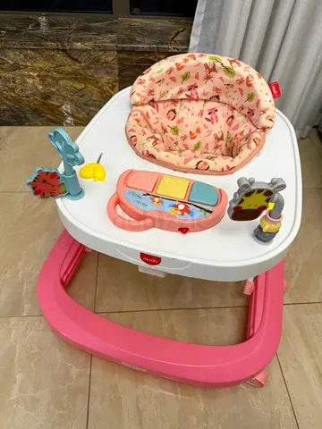 Pink baby learning walker with music and toy - good condition