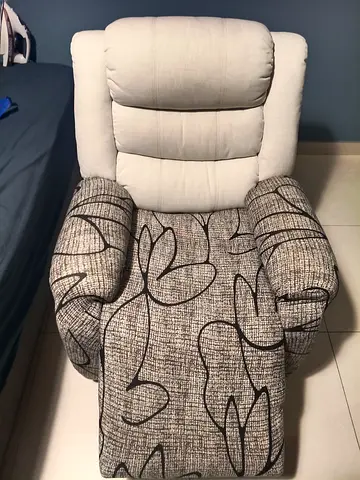 Electric Single Recliner Armchair - Fabric Upholstered, Light Grey Patterned .Covered and protected