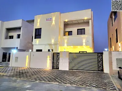 Luxury villa facing a garden and mosque in Al Bahia, with high-end stone finishing, price includes registration fees.