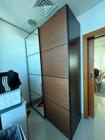 Slim modern sliding-door wardrobe with mirror — good condition