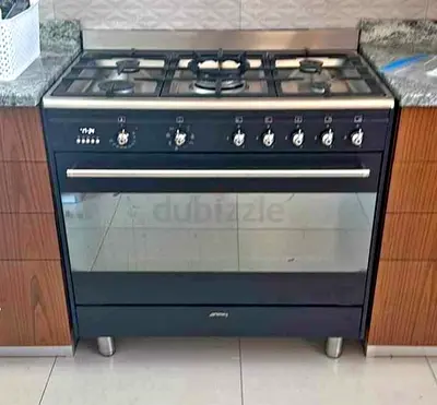 Smeg Concert range cooker (model SSA91MABL2 or similar) featuring a 5-burner gas hob and a large ele