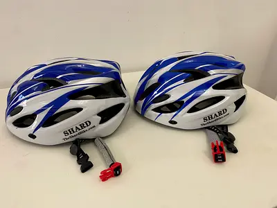 Pair of Shard Blue and White Cycling Helmets
