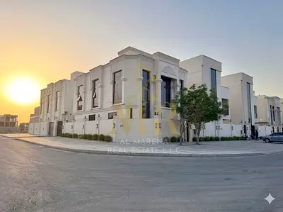 A luxurious classic villa in Al Helio 2, featuring an elegant design and distinctive finishes. Enjoy a tranquil location and spacious living areas, pe