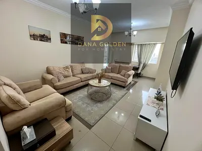 Two bedrooms, a living room, a maid's room, three bathrooms, and two balconies for monthly rent in Sharjah, Al Taawun area, all-inclusive.