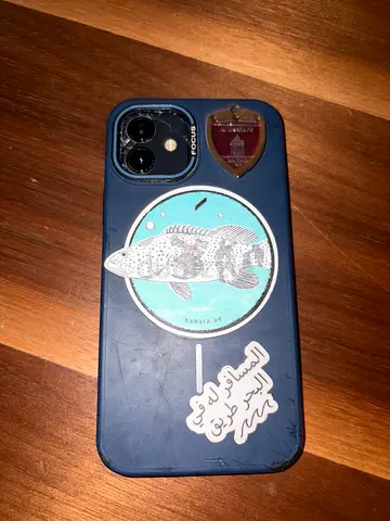 iPhone (with case and stickers) - Good working condition only back of phone cracked