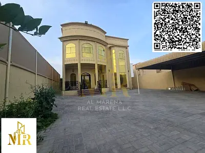 Modern villa for sale in Al Muwaihat 1 area, Ajman. Two floors plus a roof terrace. Excellent location opposite a park and mosque. Price includes elec