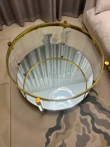 Gold coffee table with mirror in the middle very Luxury brand new used very little only for who like