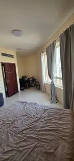 semi-furnished private room. Available in Alnahda 2 opposite pond park . Close to bus station