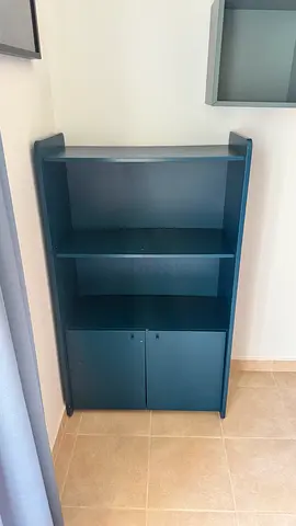 Blue wooden bookshelf with lower cabinet - good condition