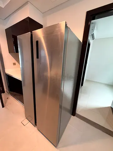 Stainless steel double-door refrigerator in good condition