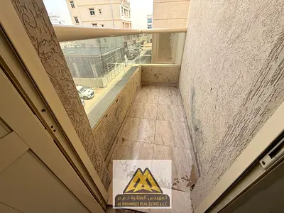 A spacious one-bedroom apartment with a balcony and a view in the Al-Aliya area, near Mohammed Bin Zayed Road and all services.