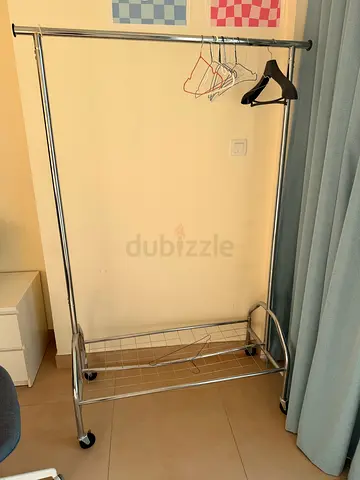Chrome double rail clothes rack with wheels — good condition