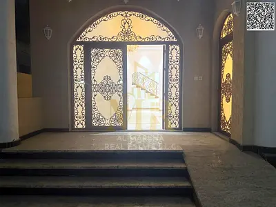 Two-story villa with a rooftop terrace, including electricity, water, and air conditioning, in one of Ajman's most prestigious areas. Freehold ownersh
