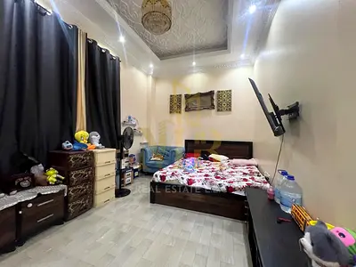 Luxury villa with 5 master bedrooms and roof terraces in Al Muwaihat 3, including electricity, water, and air conditioning.