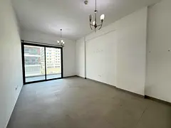 Modern 1BR | Balcony with Open View | Warsan 4